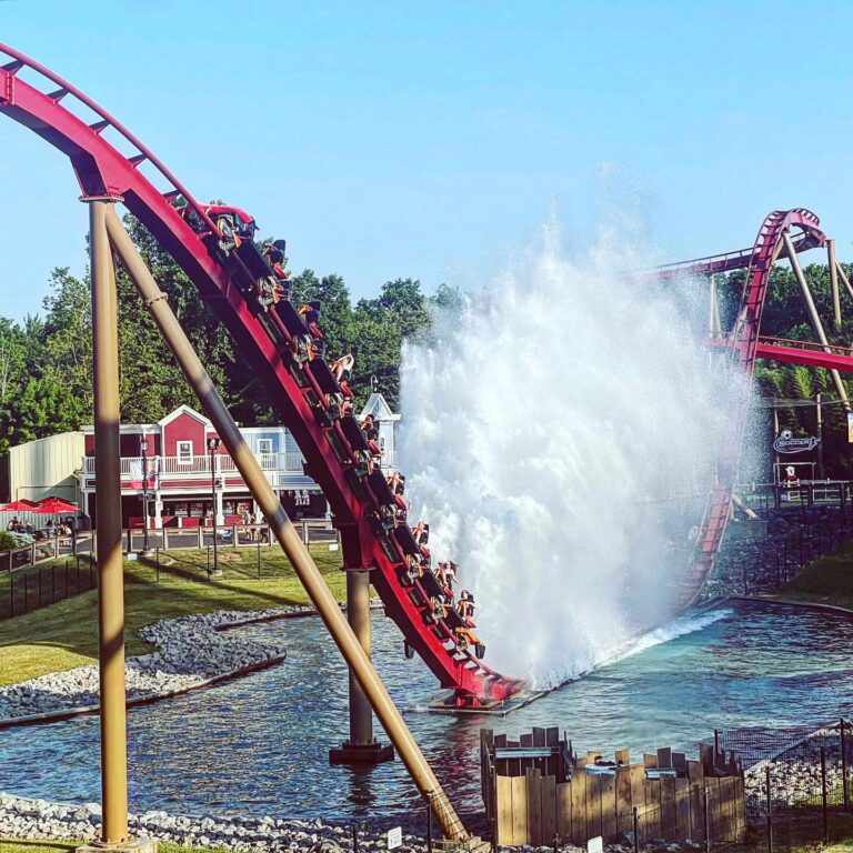 Diamondback’s train hitting the splashdown finale at Kings Island, 2023.