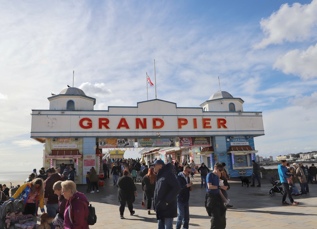 People walk on a pier with a