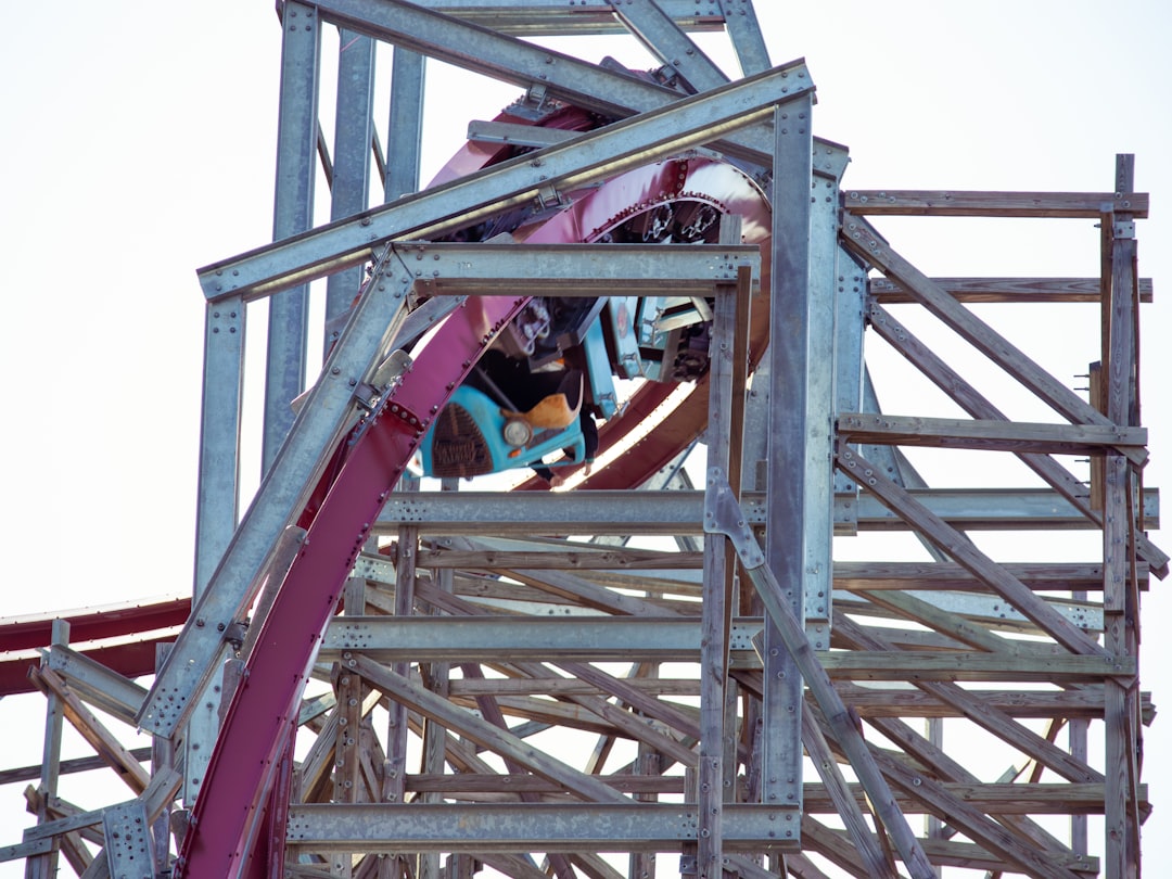 types of roller coasters - a person climbing a metal structure