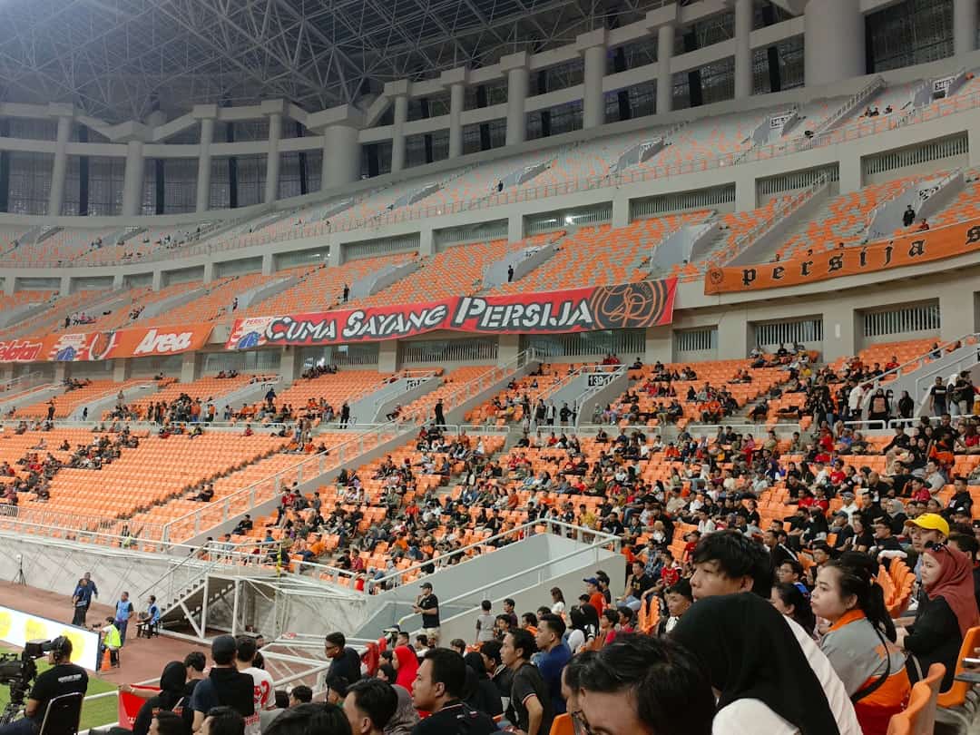 loudest stadiums in the world - a large crowd of people sitting in a stadium