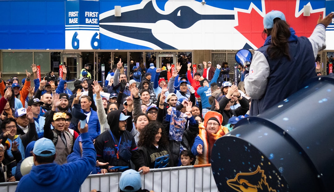 tracking roller coasters - Crowd cheering for toronto blue jays players during a parade.