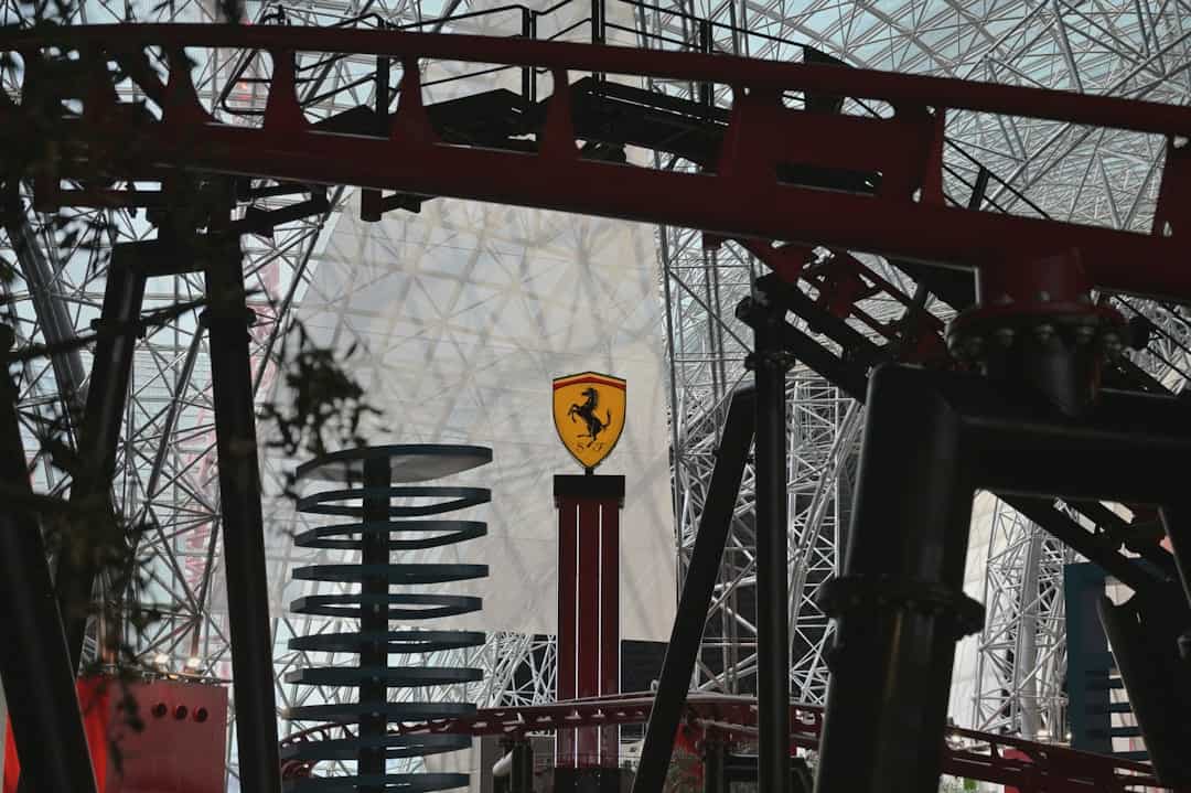 types of theme parks - Ferrari logo on a roller coaster structure
