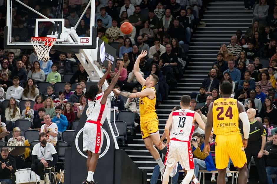 thrill news April 2026 - Dramatic moment in a basketball game with players and an engaged crowd.