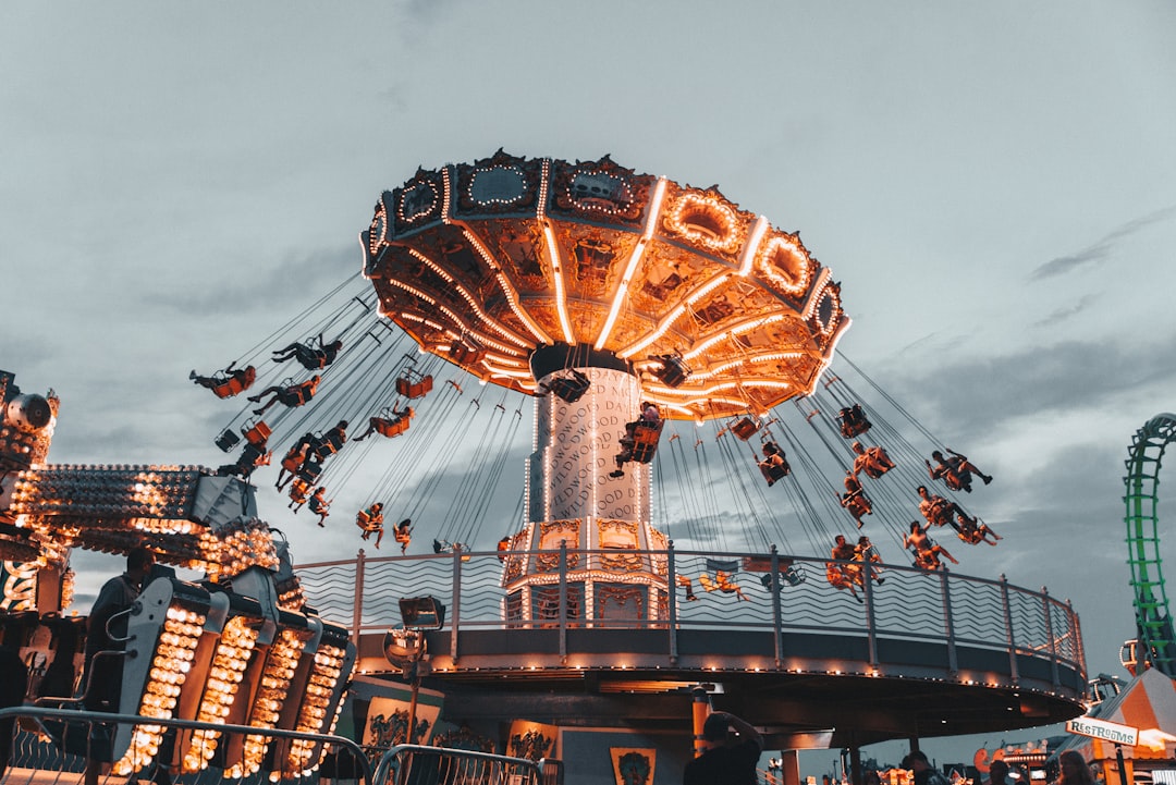 theme park news May 2026 - people riding amusement park ride