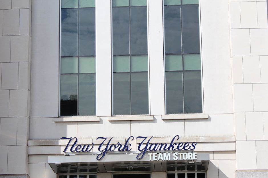 sports venues - Close-up of the New York Yankees Team Store facade, featuring modern architecture.