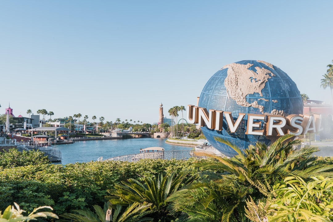 theme park news - blue and white globe near body of water during daytime