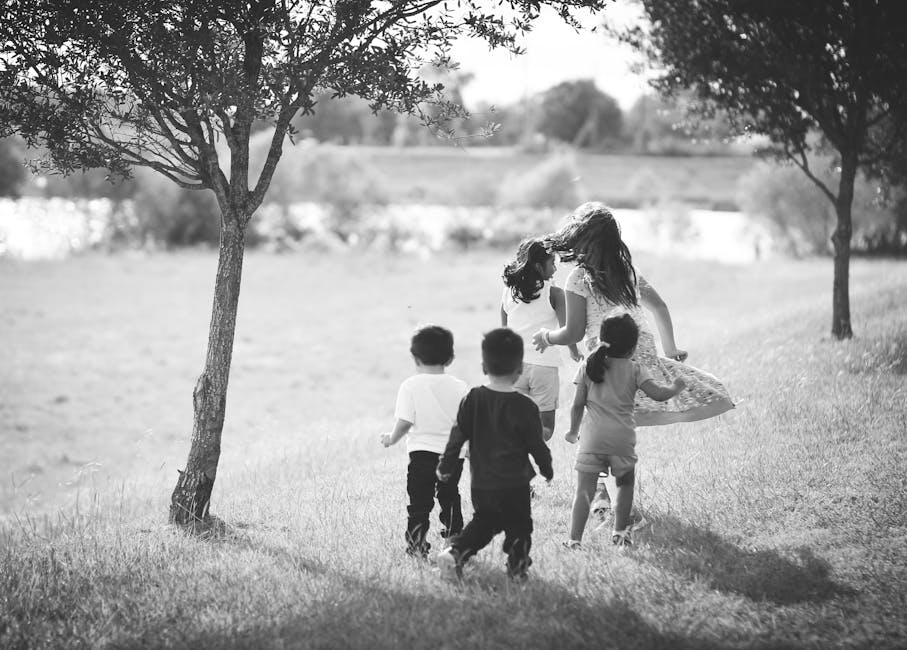 theme park news - Group of kids joyfully running in a park setting in Houston.