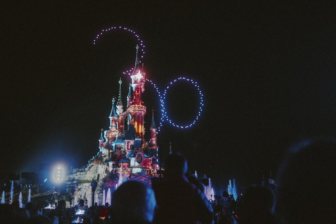 theme park news - a crowd of people watching a carnival