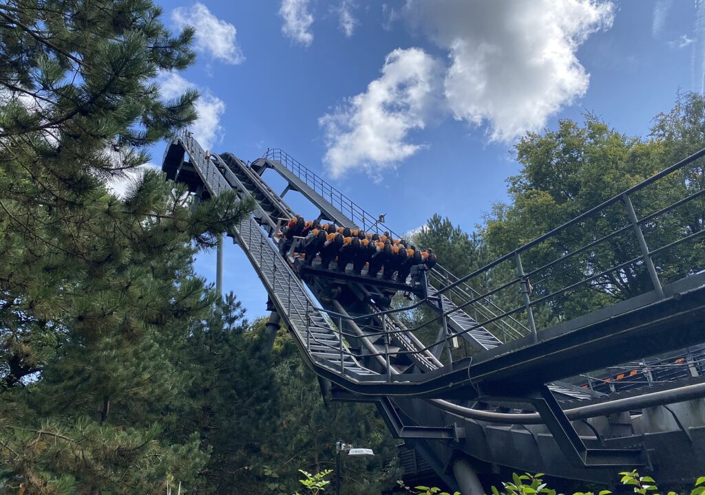Riders cresting the vertical drop of Oblivion at Alton Towers