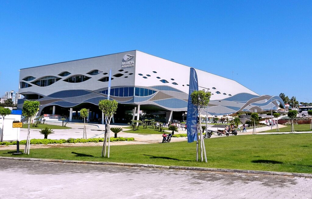 Exterior of the Antalya Aquarium building with its wave-patterned facade