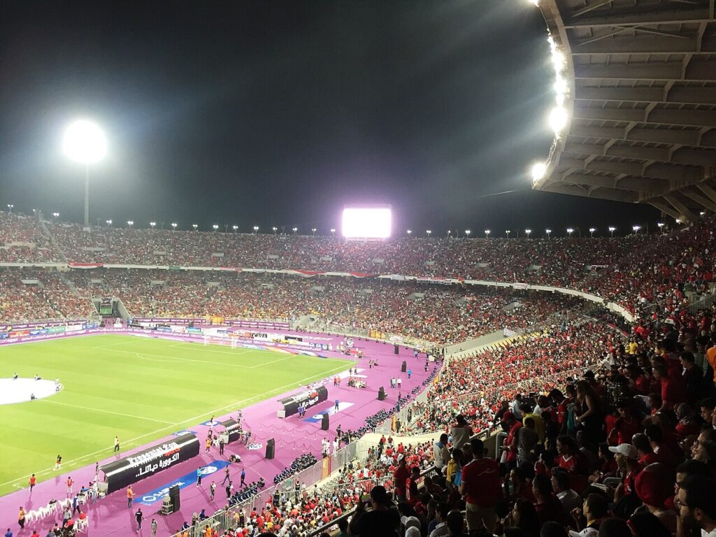 Packed Borg El Arab Stadium at night during the Egypt vs Congo World Cup qualifier in October 2017