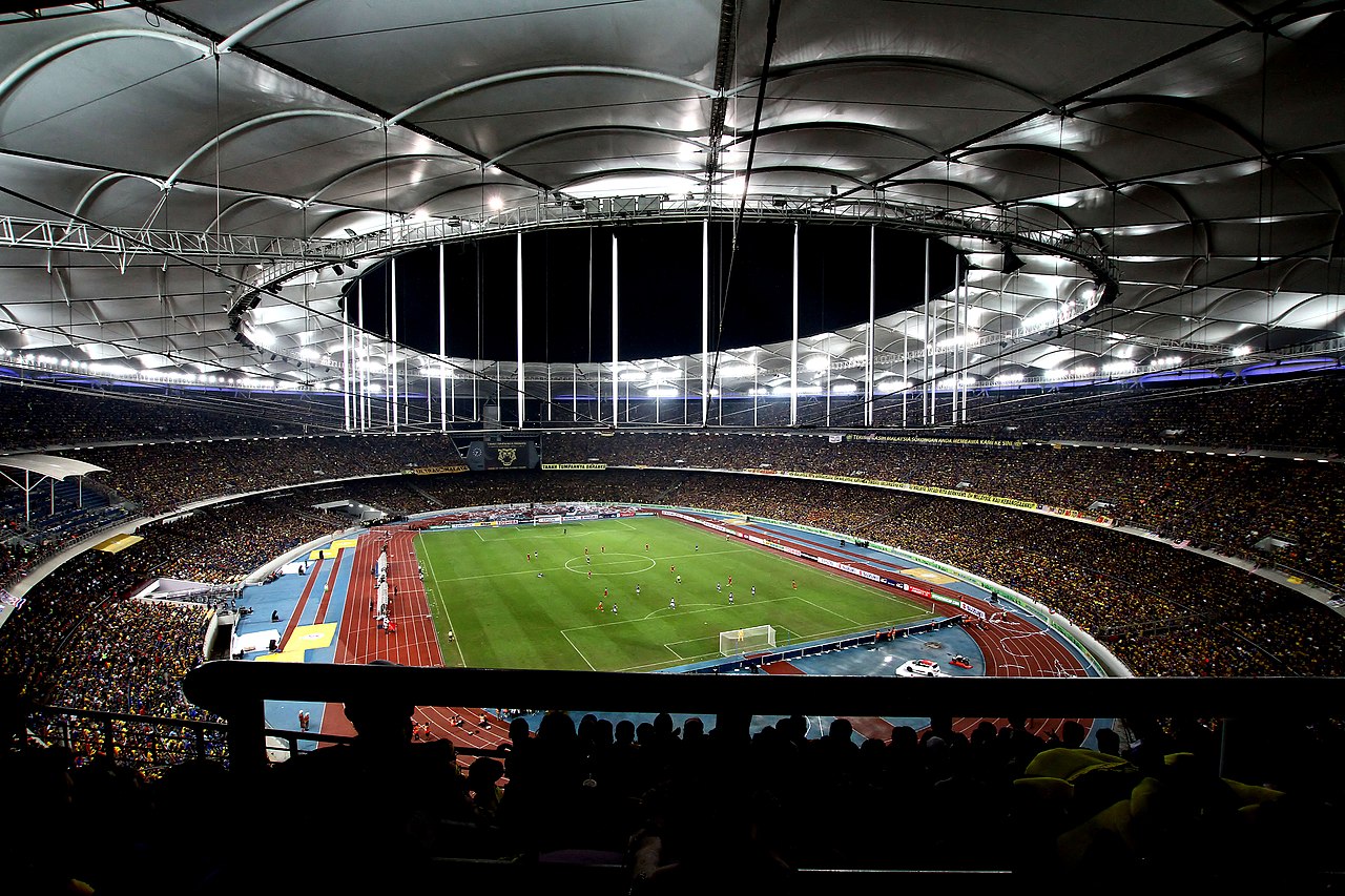 Packed interior of Bukit Jalil National Stadium at night during the 2014 AFF Suzuki Cup final