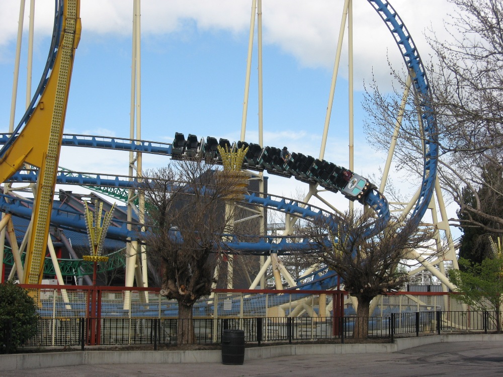 Colossus the Fire Dragon's train banking through the blue turnaround track at Lagoon amusement park