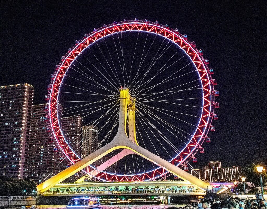 The Tianjin Eye ferris wheel illuminated at night