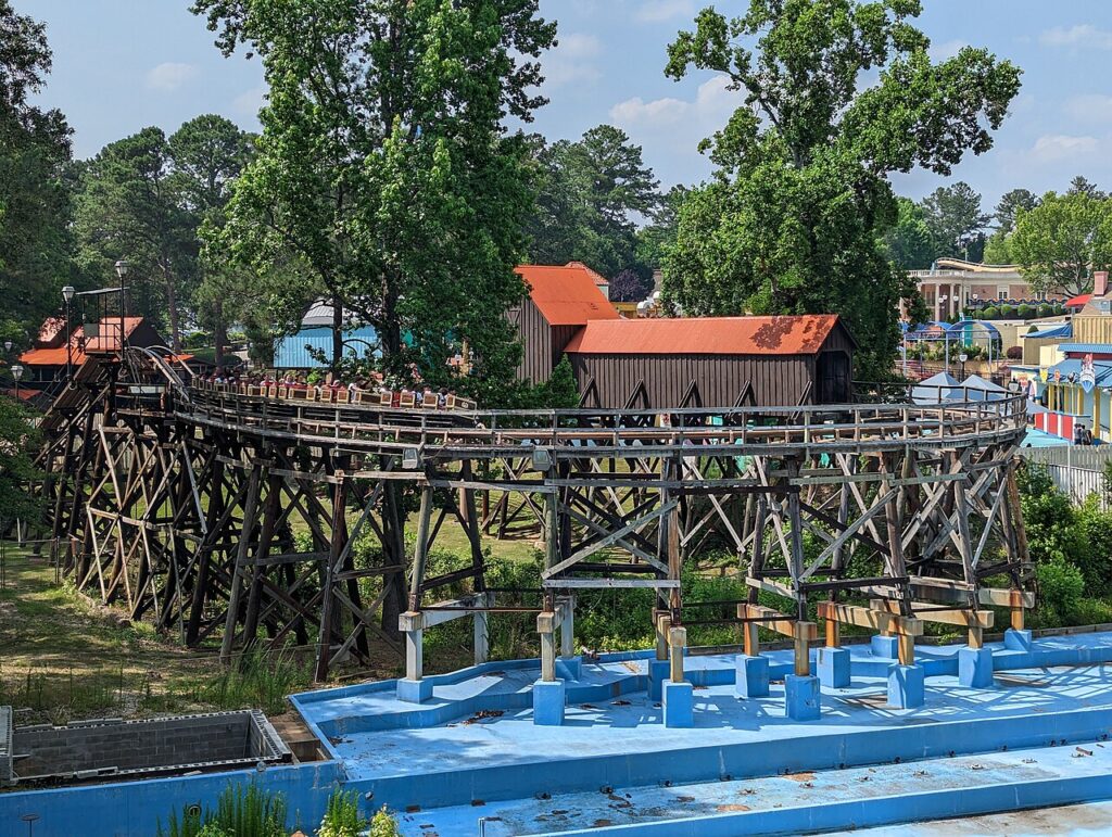 Dahlonega Mine Train coaster winding through the trees at Six Flags Over Georgia