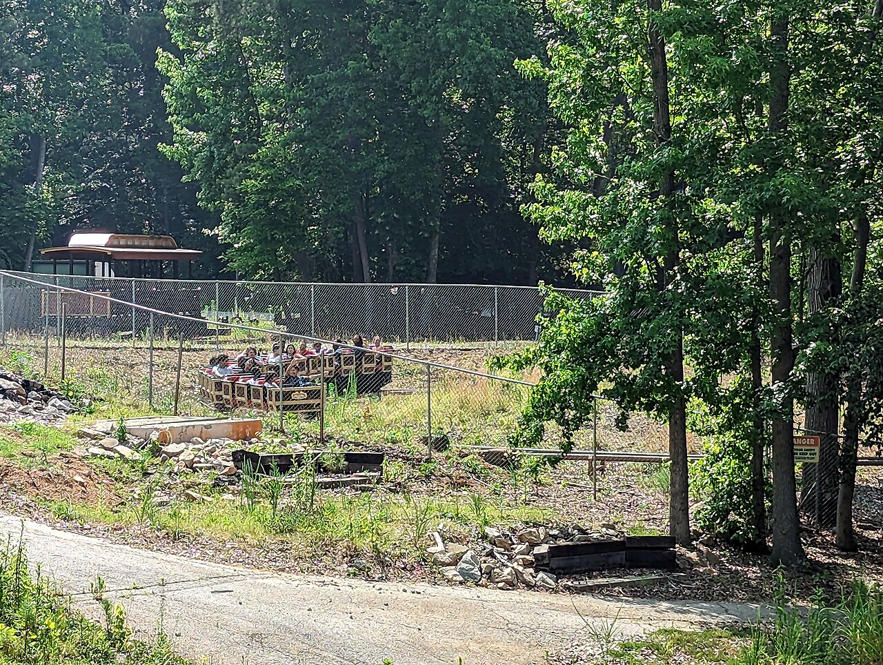Dahlonega Mine Train rounding the wooded course at Six Flags Over Georgia