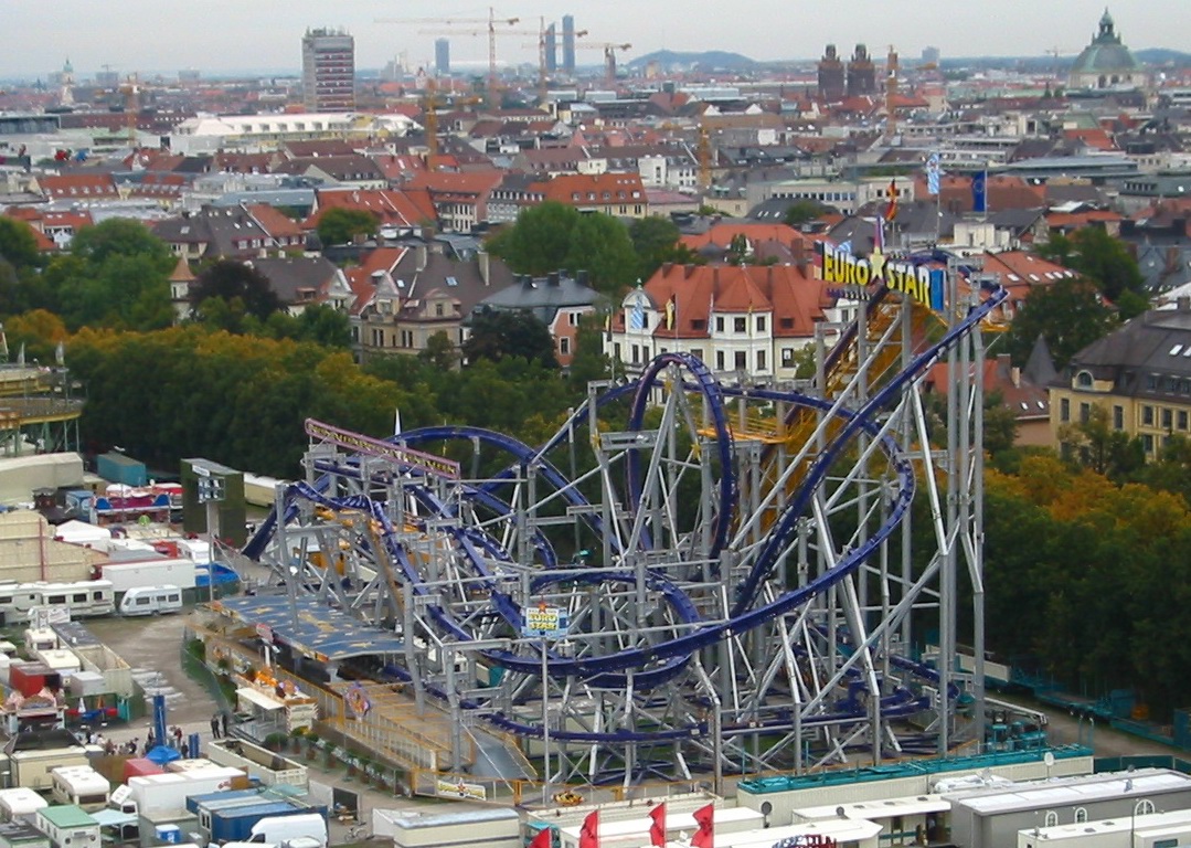Euro-Star inverted coaster with purple track set up at Oktoberfest in Munich in 2005, seen from a Ferris wheel