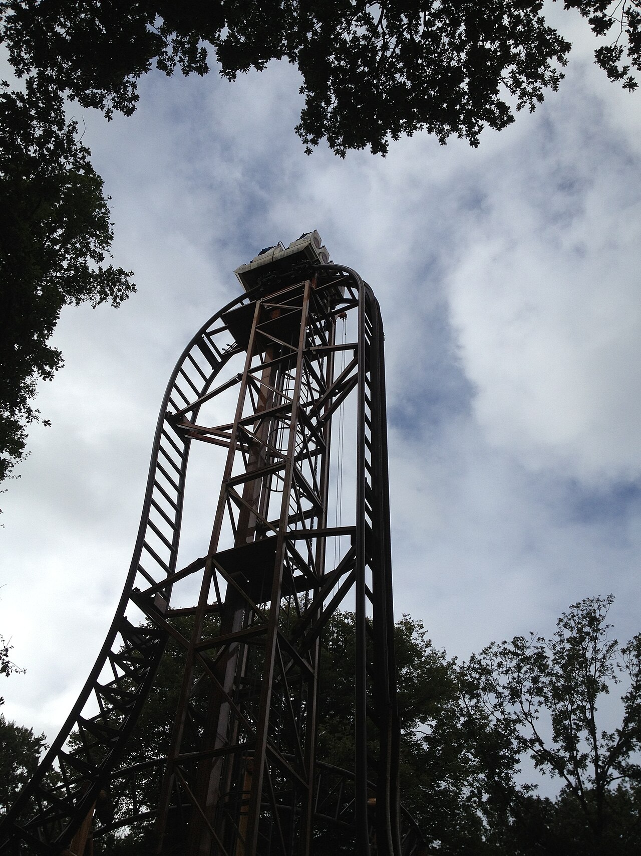 The crest of Falcon's tower rising above the treetops at Duinrell in Wassenaar