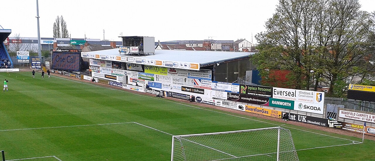 The low Bishop Street Stand running along one side of Field Mill in Mansfield