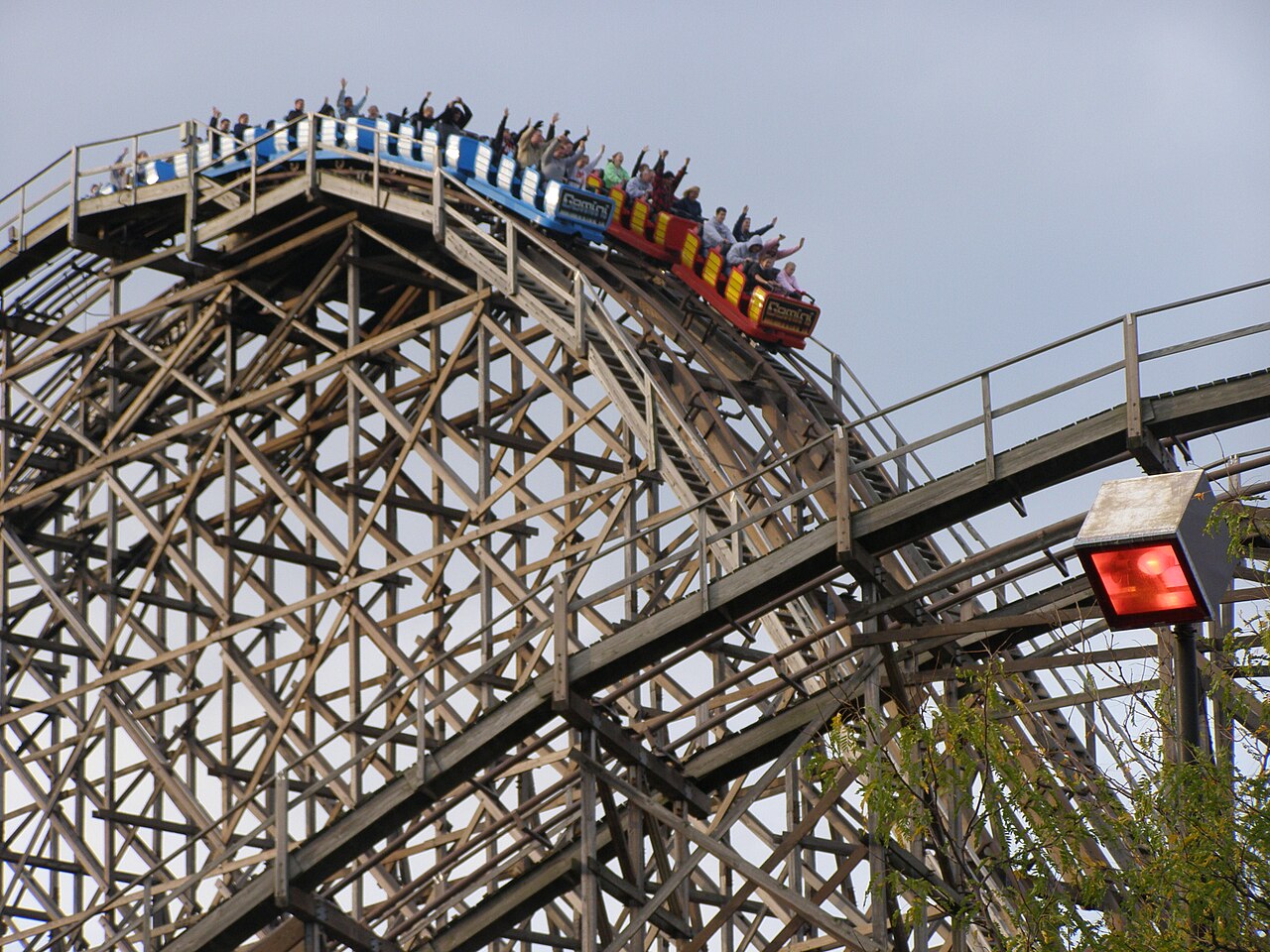 Gemini's red and blue trains racing down the first drop at Cedar Point
