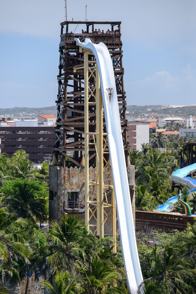 Rider plunging down the near-vertical Insano water slide tower at Beach Park in Fortaleza, Brazil