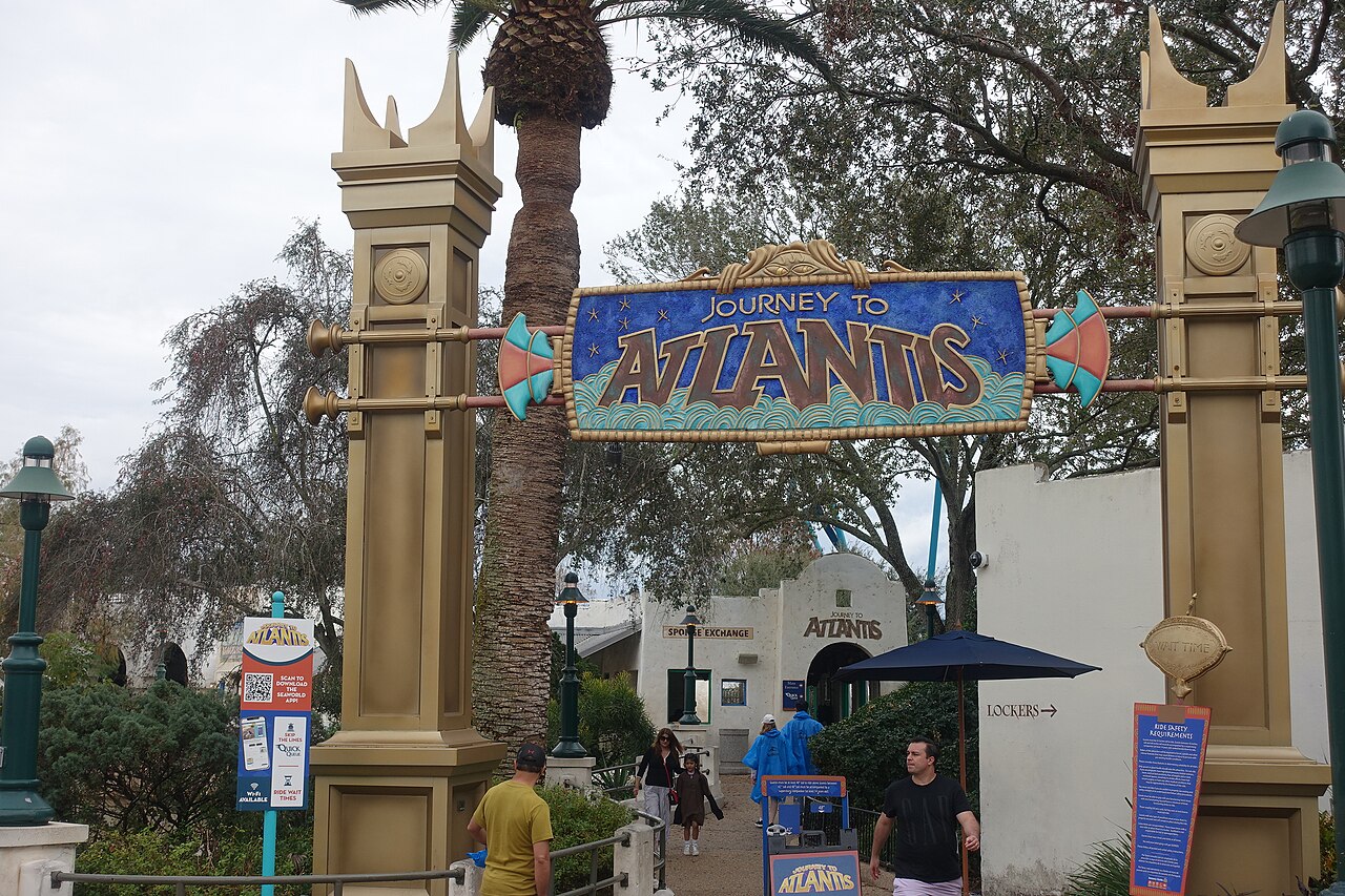 Golden pillars and Journey to Atlantis sign at the ride entrance at SeaWorld Orlando