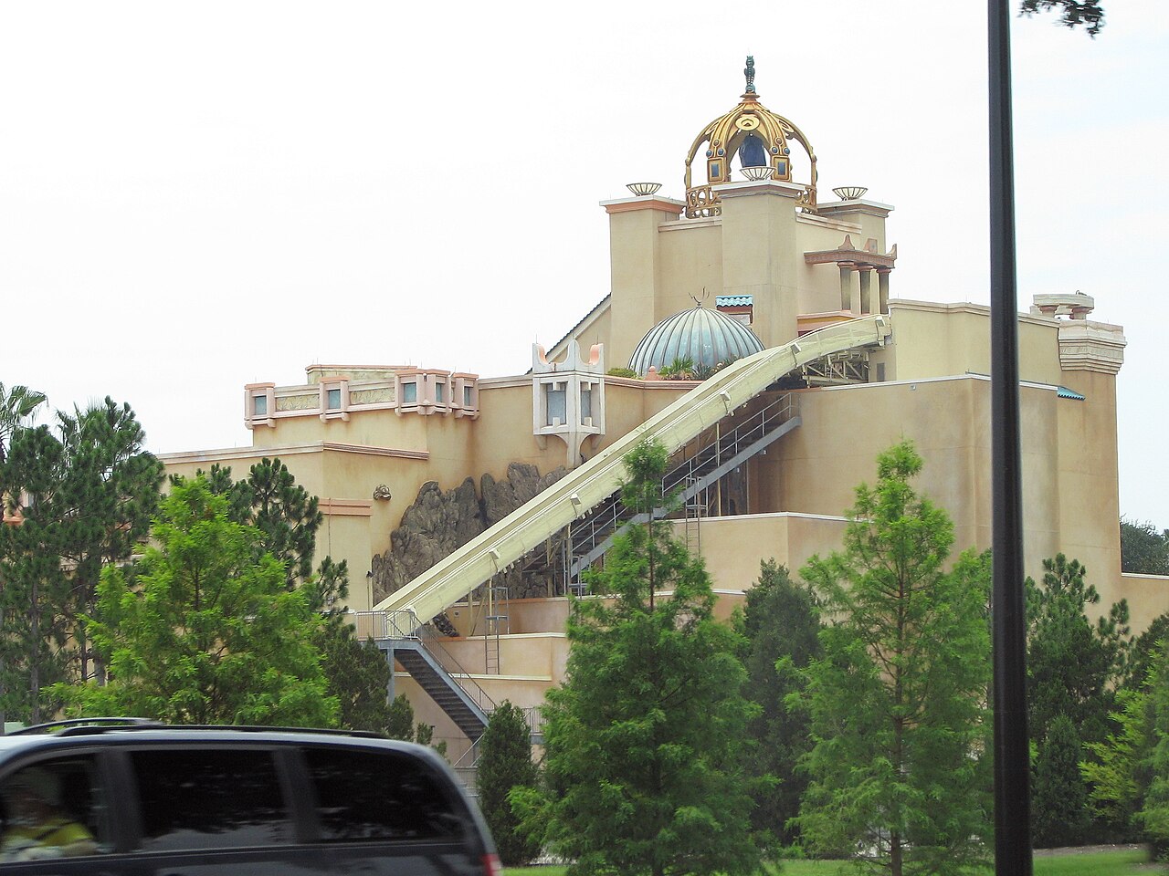 Exterior of the Journey to Atlantis show building at SeaWorld Orlando with the final drop chute visible