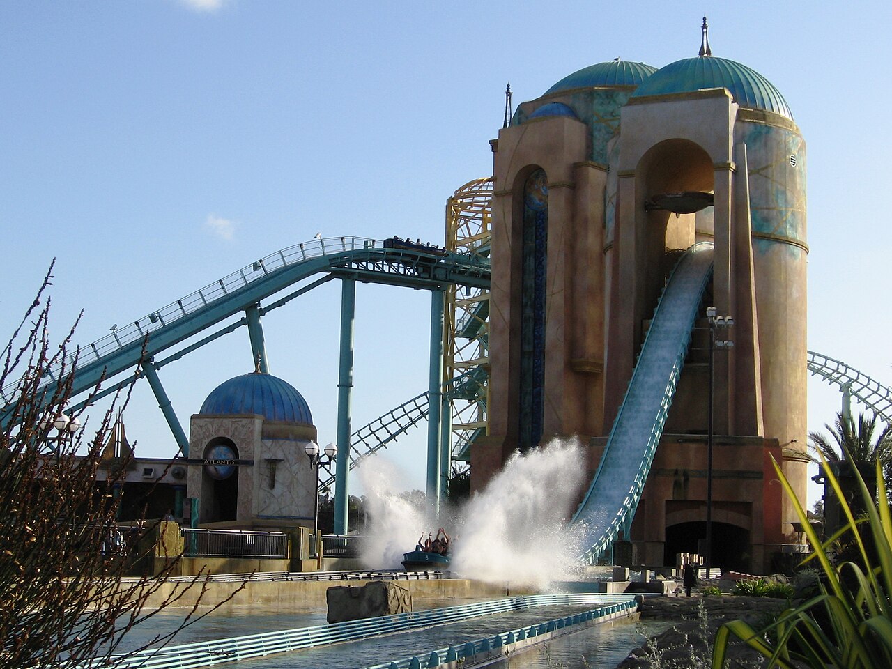 Journey to Atlantis at SeaWorld San Diego with its twin blue-domed towers, coaster track and a boat splashing down