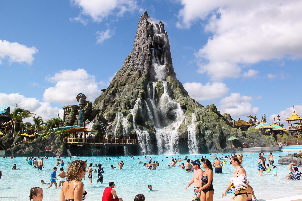 Guests in the wave pool beneath the Krakatau volcano at Universal Volcano Bay