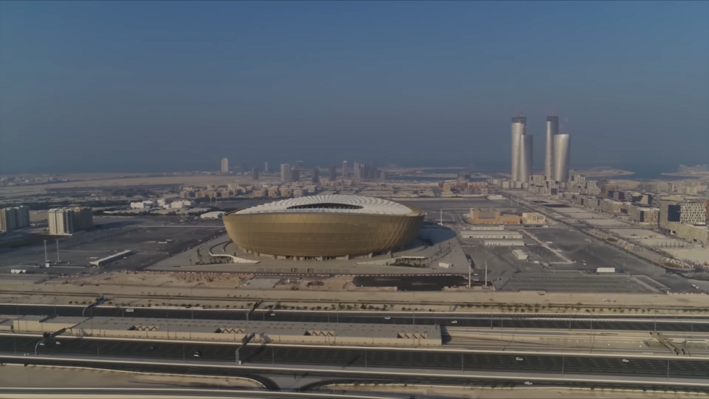 Aerial view of the golden, vessel-shaped Lusail Stadium in Lusail, Qatar