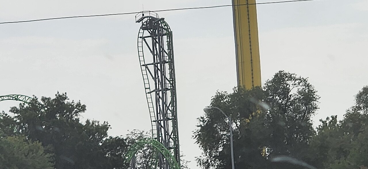 Distant view of The Monster's 101-degree drop and lift tower at Adventureland