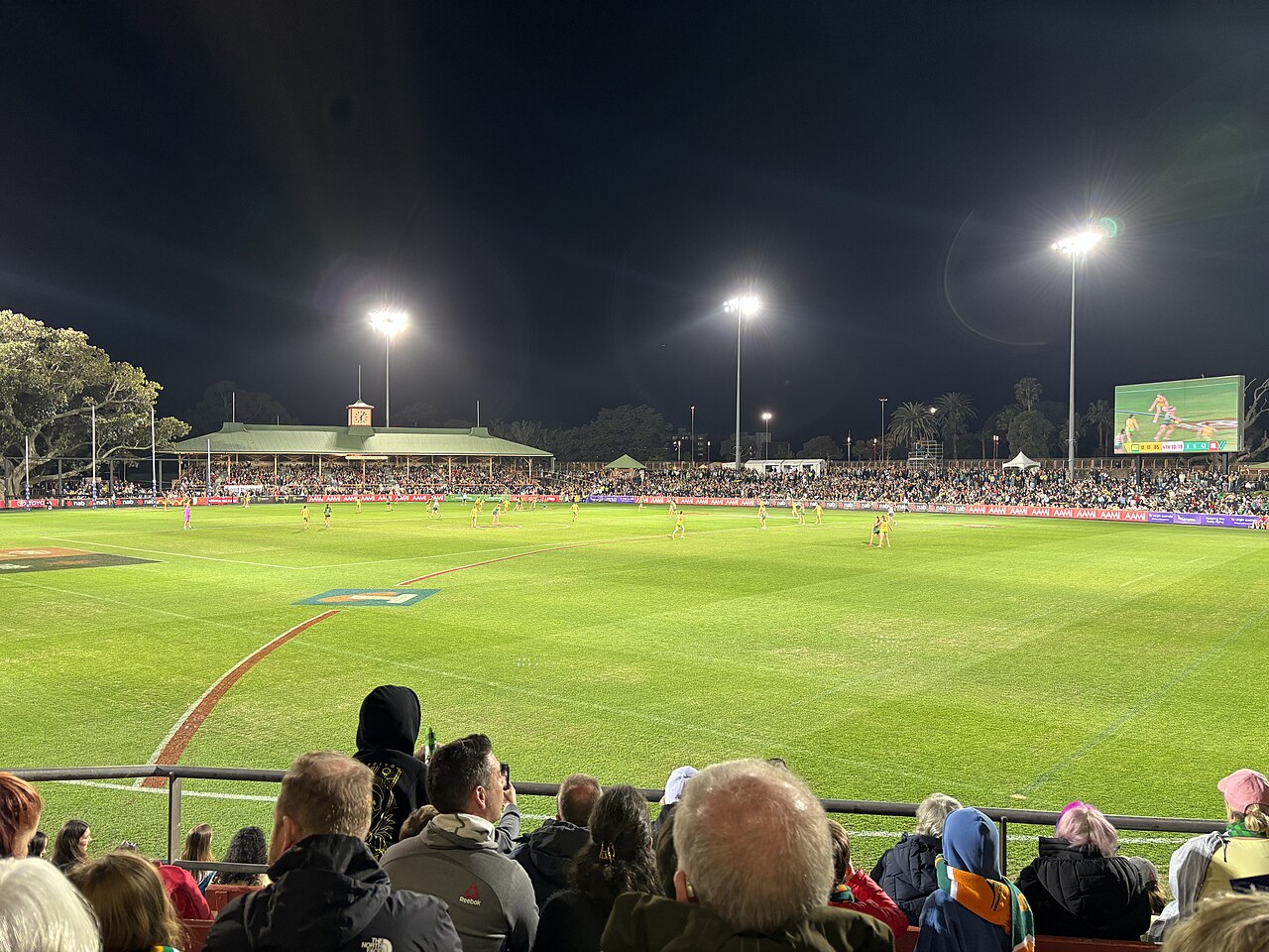 A ring of heritage grandstands at North Sydney Oval during an AFL Women's match
