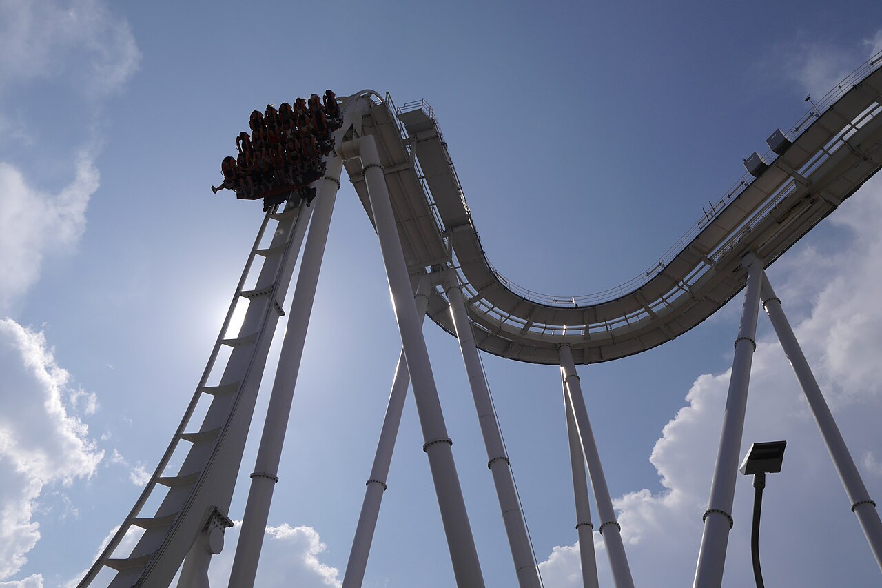 Oblivion: The Black Hole train hanging over the edge of the vertical drop at Gardaland