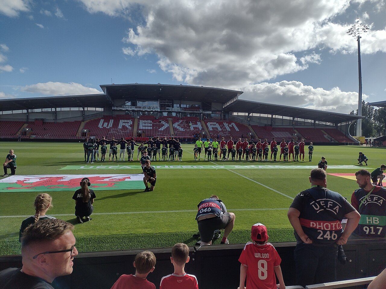 Wales and Spain line up in front of the Macron Stand at the Racecourse Ground in 2026