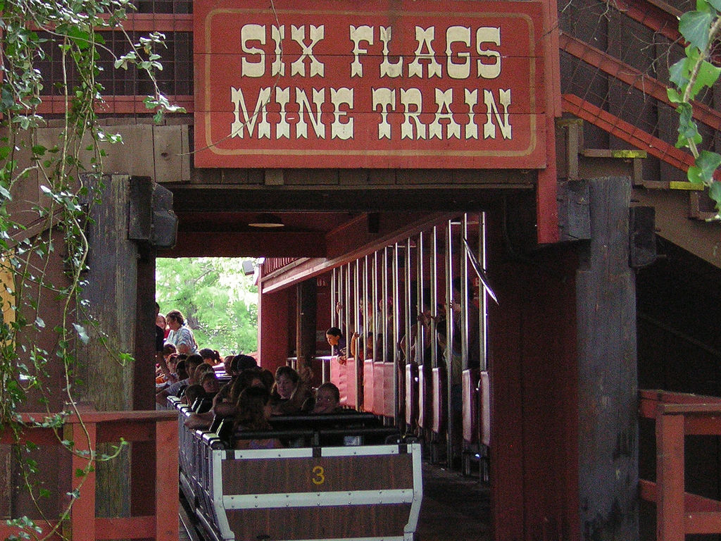 Six Flags Mine Train station entrance with a loaded train at Six Flags Over Texas