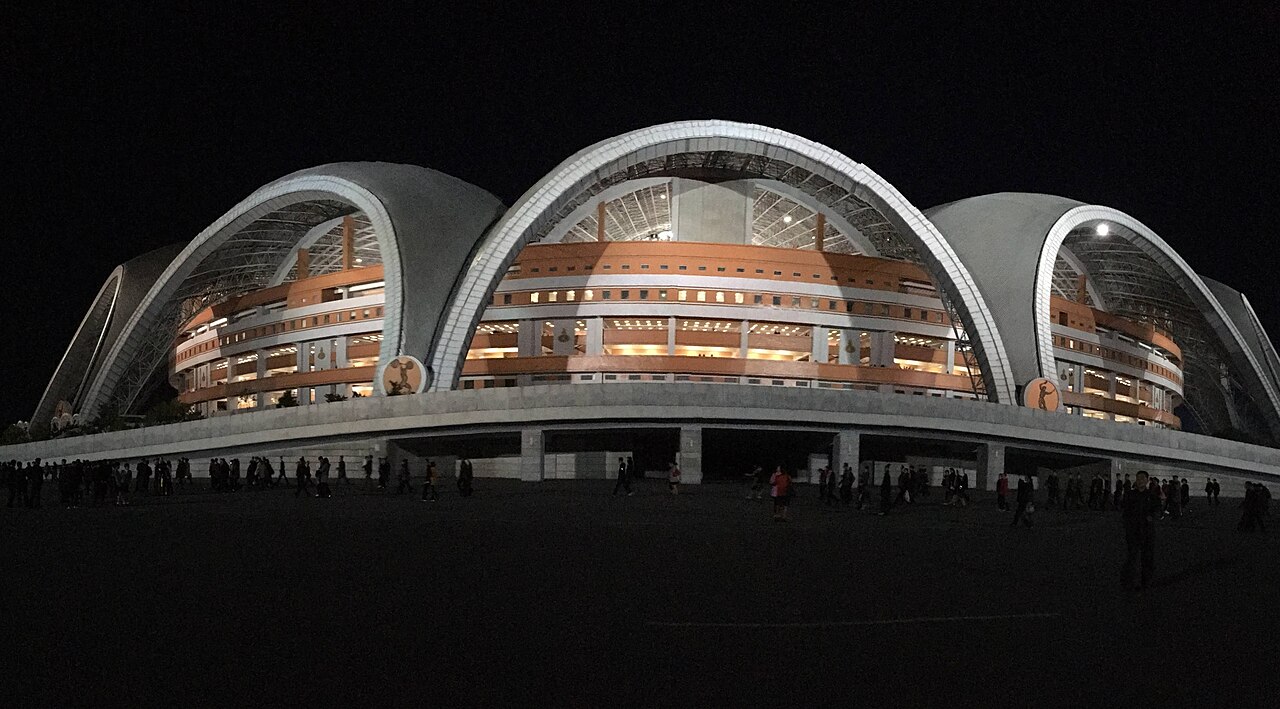 Rungrado 1st of May Stadium illuminated at night on Rungra Island