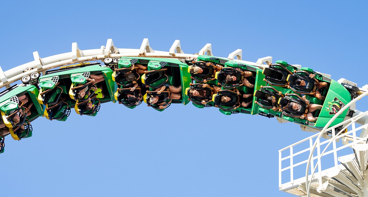 Green Sea Serpent train inverting through the white cobra roll at Morey's Piers in Wildwood