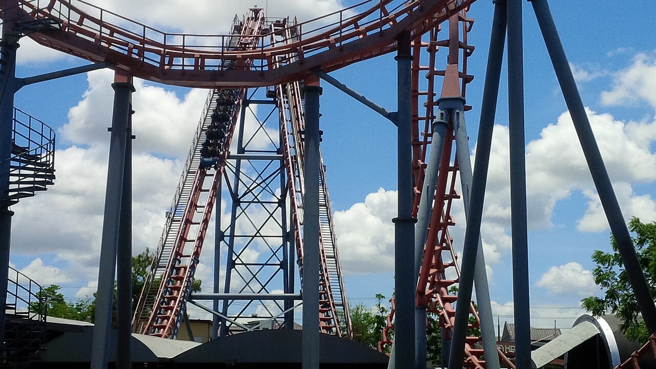 Train being hauled up the rear lift of the Space Shuttle Boomerang coaster at Enchanted Kingdom