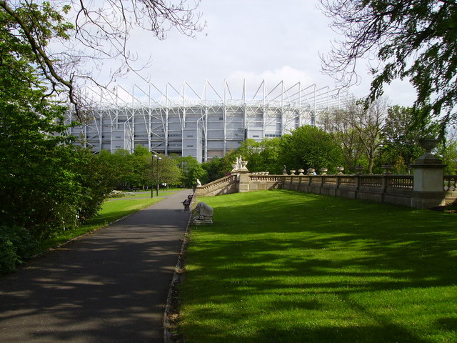 The north west corner of St James Park rising above the trees of Leazes Park
