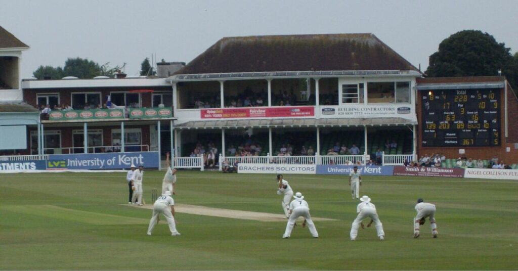 Kent County Cricket Club fielding in front of the pavilion at the St Lawrence Ground, Canterbury