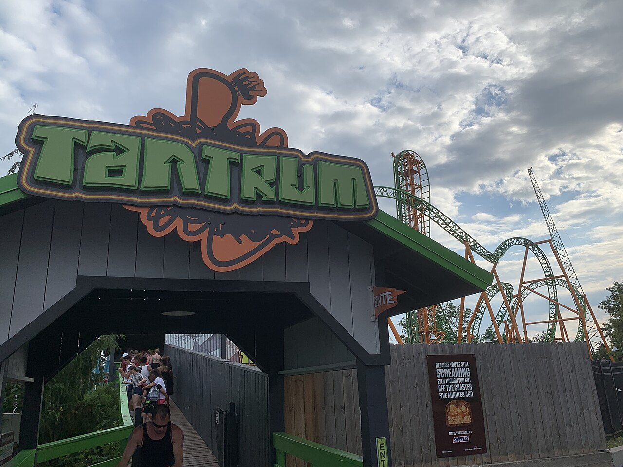 Tantrum entrance sign with the coaster's vertical lift behind at Six Flags Darien Lake