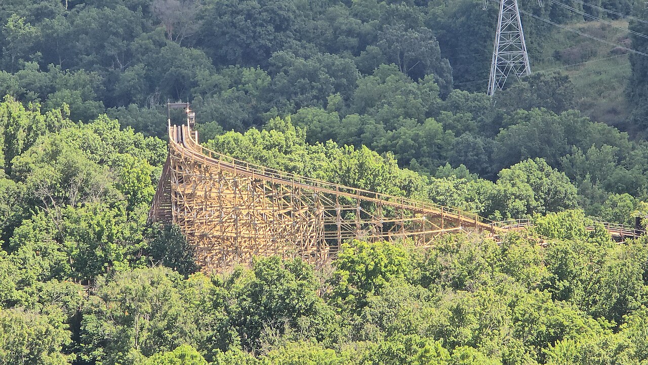 The Beast's second lift hill rising out of the forest at Kings Island