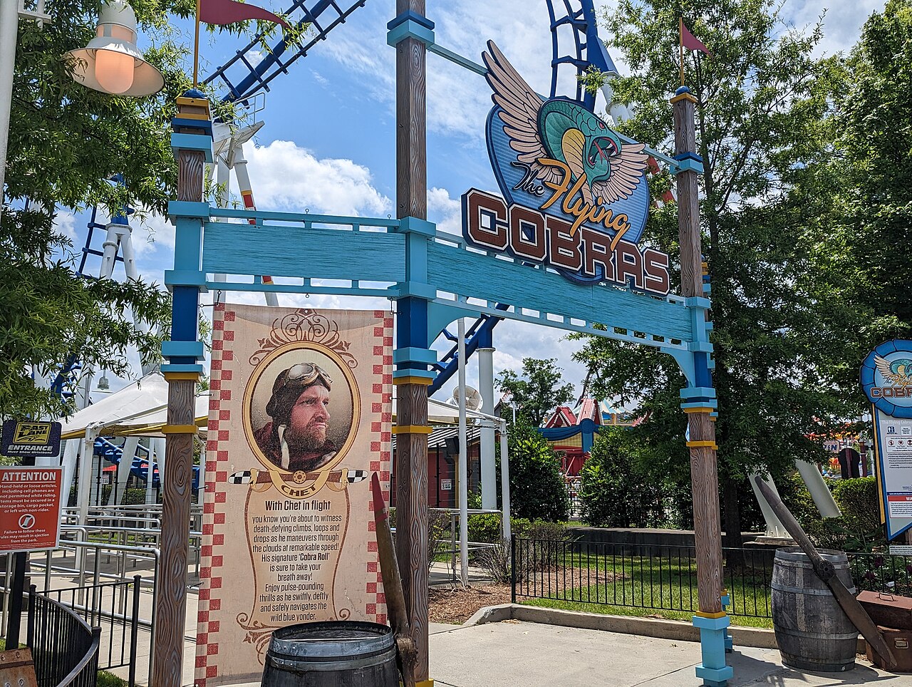 Entrance sign of The Flying Cobras roller coaster at Carowinds with aviator theming