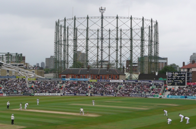 The Victorian gasholder rising behind the stands during a Test match at The Oval
