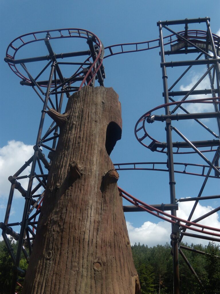 Timber Drop roller coaster and its artificial tree trunk at Fraispertuis-City, France