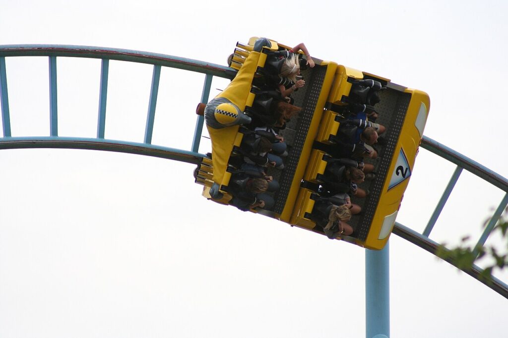 Vild-Svinet roller coaster car with wild boar theming on teal track at BonBon-Land, Denmark