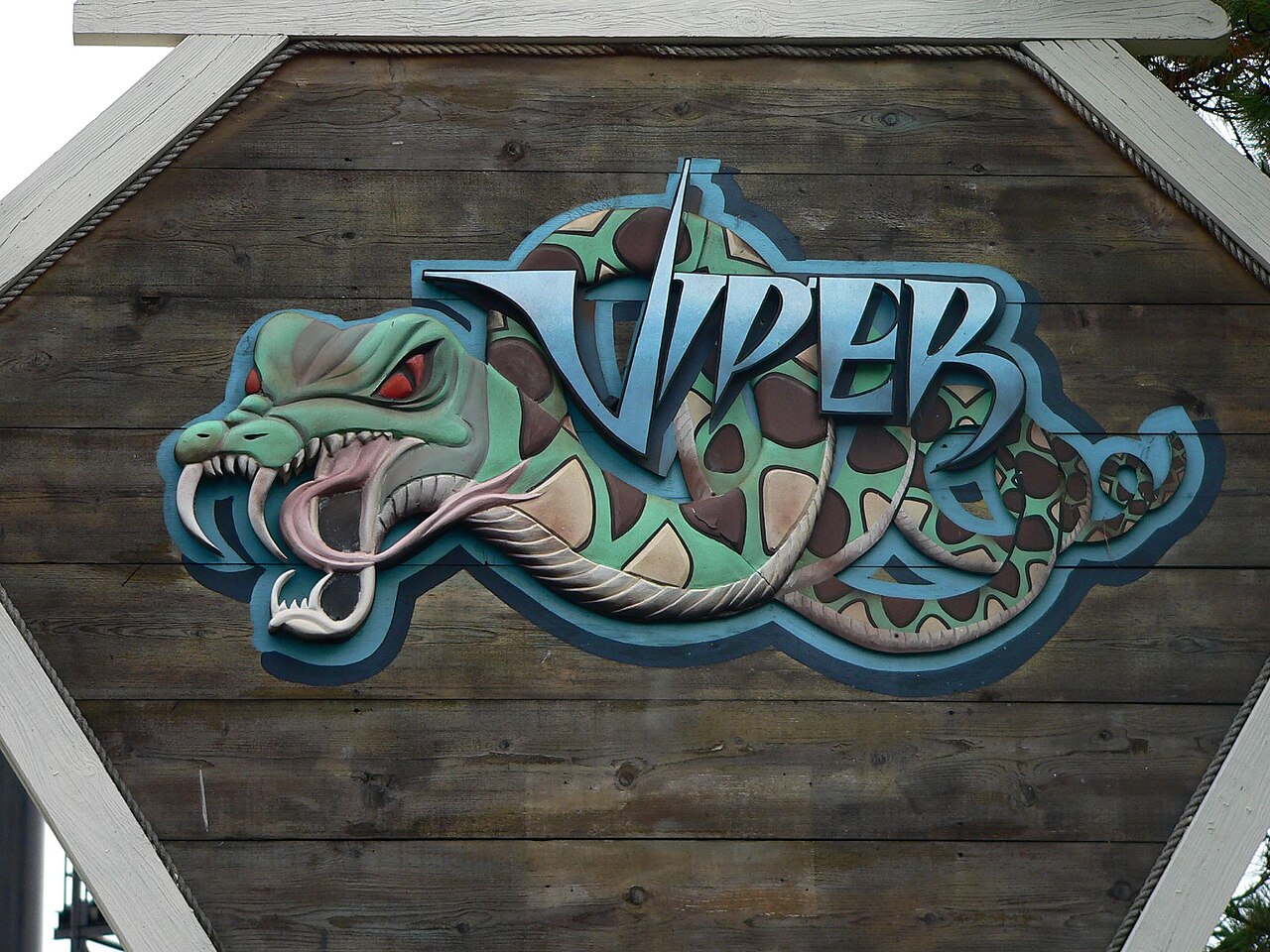 Carved wooden Viper entrance sign with a fanged snake at Six Flags Darien Lake