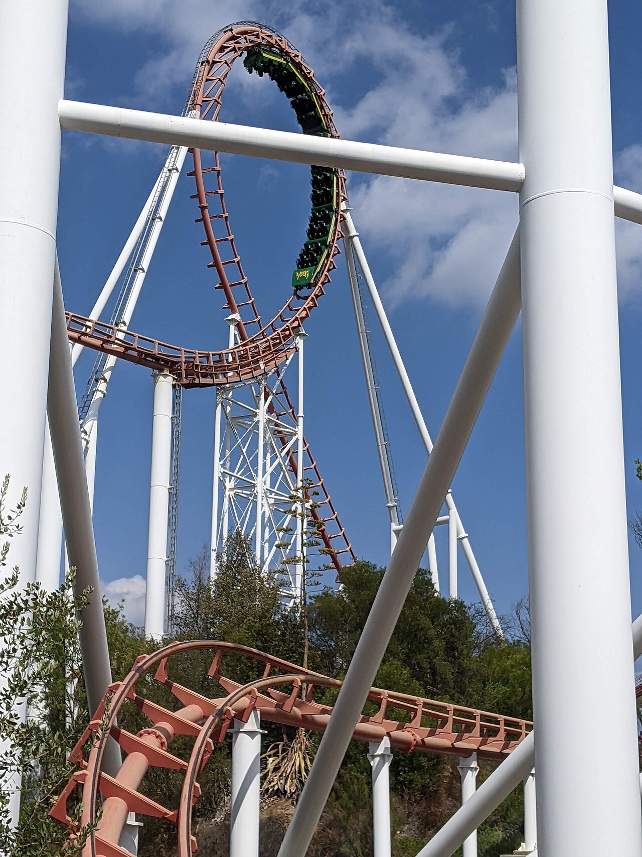 Viper's green train rounds the 144-foot first vertical loop at Six Flags Magic Mountain