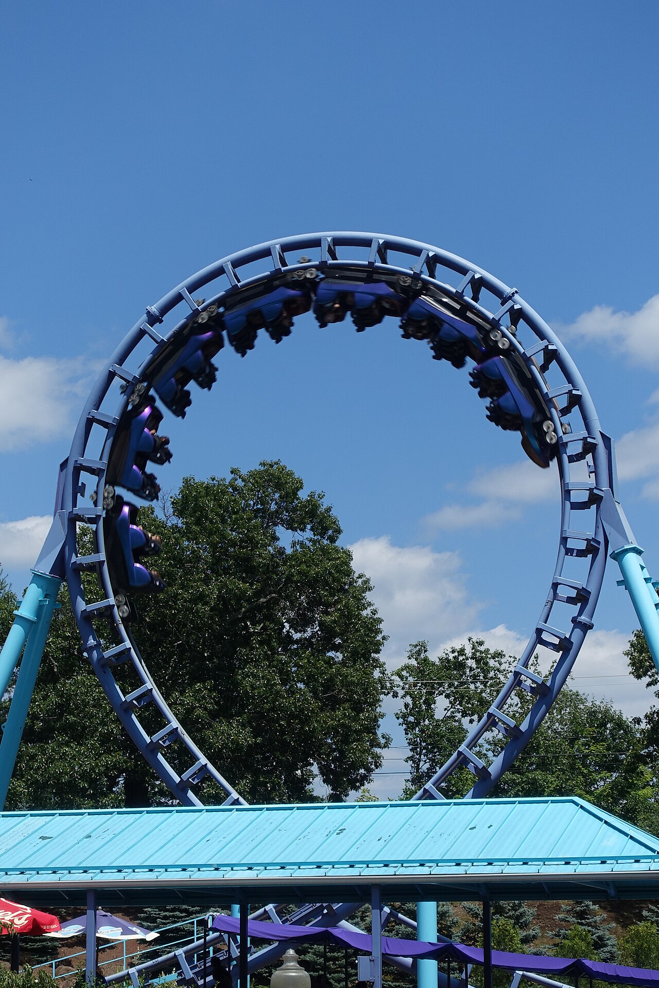 Zoomerang's purple train inverting through the vertical loop at Lake Compounce
