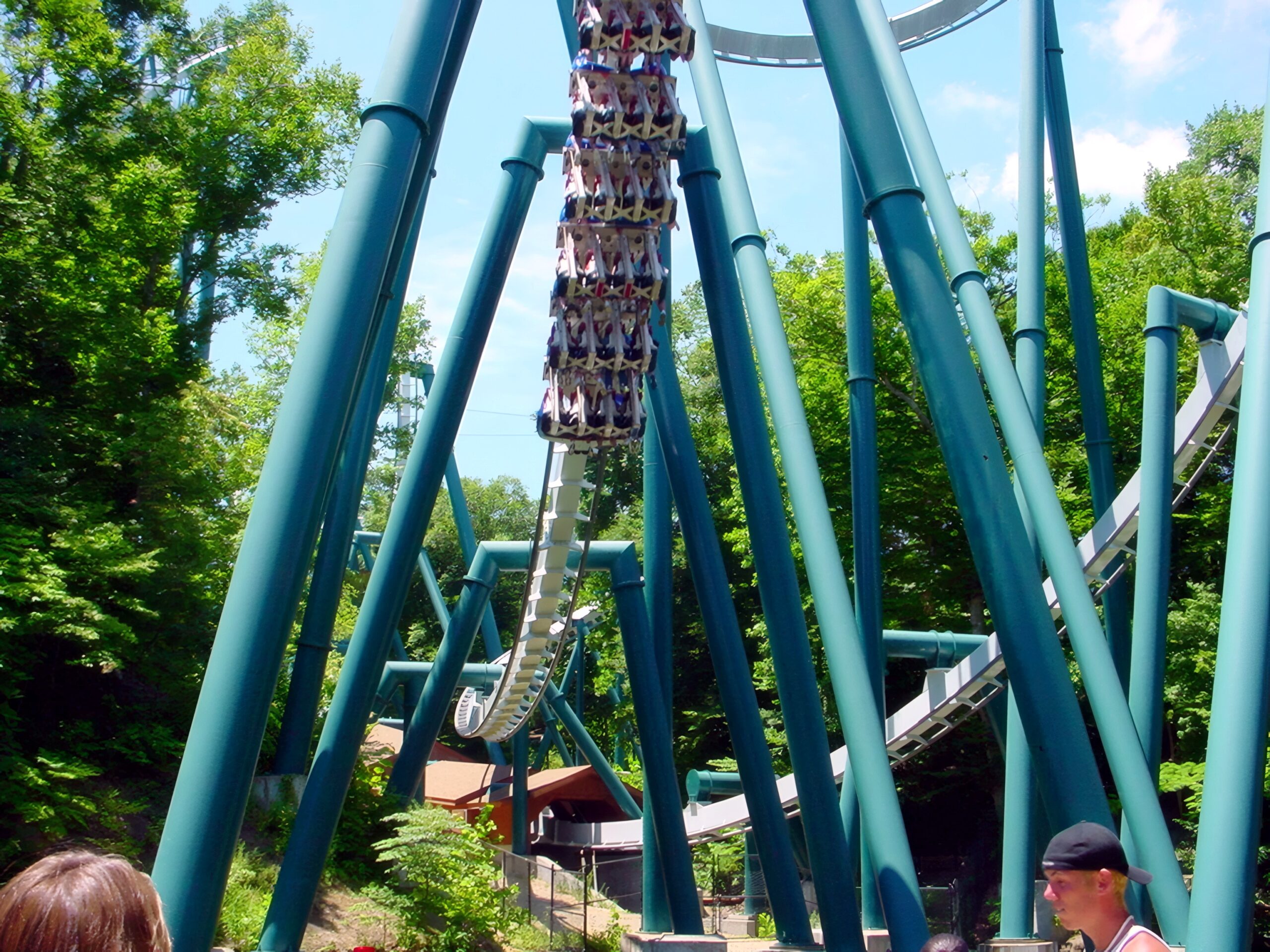 An Alpengeist train exiting the cobra roll, riders' feet dangling, July 2001